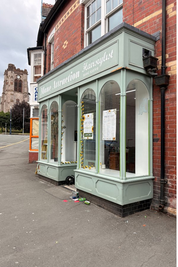 Shopfront before repaint, commercial painting Conwy